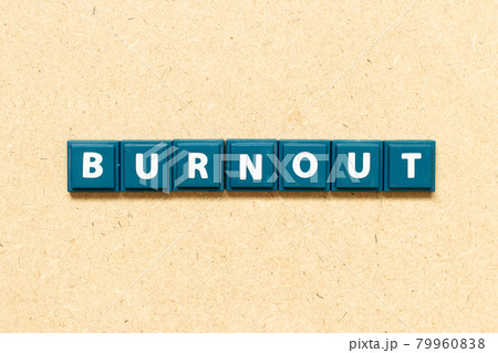Tile alphabet letter in word bunout on wood background 79960838