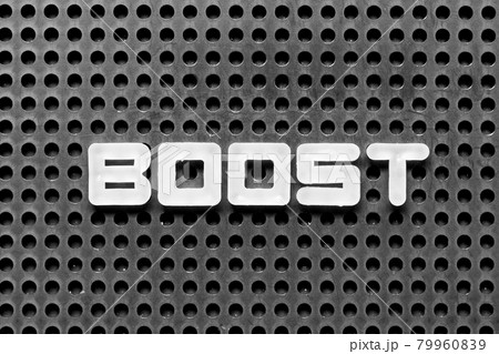 White alphabet letter in word boost on black pegboard background 79960839