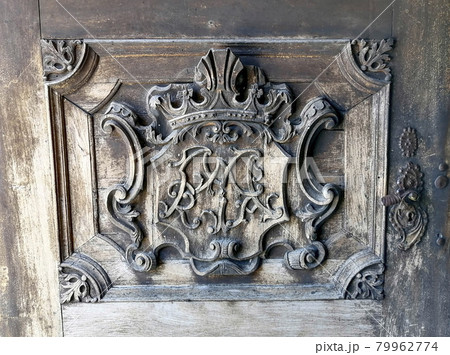 Detail of a beautiful old wooden door of Church Maria Strassengel, a 14th century Gothic pilgrimage church in the town of Judendorf Strassengel near Graz, Styria region, Austria 79962774