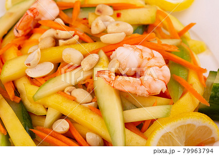 fresh cucumber, mango, shrimp, peanuts, carrots, lemon, greens fresh cucumber, mango, shrimp, peanuts, carrots, lemon, greens 79963794