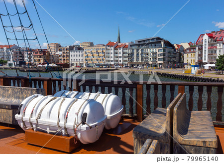 Swinoujscie. City embankment and bay on a sunny day. Swinoujscie. City embankment and bay on a sunny day. 79965140
