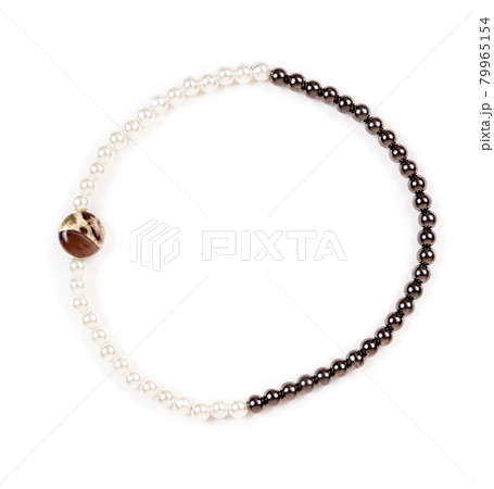 Beaded bracelet on the white surface Beaded bracelet on the white surface 79965154