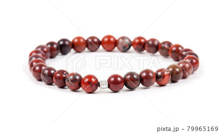 Beaded bracelet on the white surface 79965169