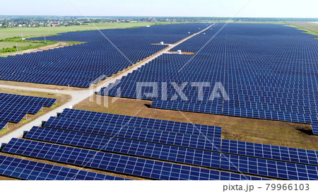 Aerial drone view flight over solar power station panels. Aerial drone view flight over solar power station panels. 79966103