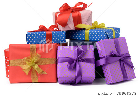 stack of boxes wrapped in paper and tied with a silk ribbon on a white background, celebration 79968578