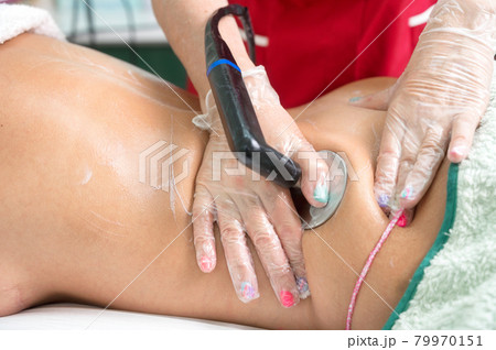 Radio Frequency bodyTreatment in beauty salon. 79970151