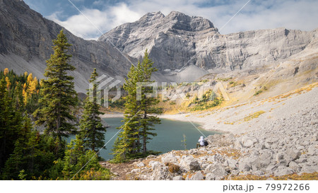 Fall in Canadian Rockies, colorful valley with mountain, golden larches and lake, shot made on Galatea Lakes trail in Kananaskis, Alberta, Canada Fall in Canadian Rockies, colorful valley with mountain, golden larches and lake, shot made on Galatea Lakes trail in Kananaskis, Alberta, Canada 79972266