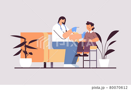 female doctor taking swab test for coronavirus sample from little boy patient PCR diagnostic procedure covid-19 80070612