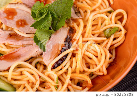 noodles with meat and sauce with greens 80225808