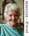 Portrait of old lady with white hair and smile 80244696