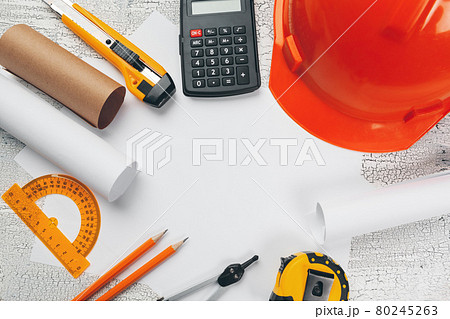 safety helmet and Scrolls of engineering drawings and supplies safety helmet and Scrolls of engineering drawings and supplies 80245263
