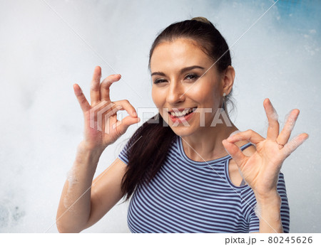 Portrait of pretty young woman in bikini having fun on soap foam disco party in the swimming pool.. Portrait of pretty young woman in bikini having fun on soap foam disco party in the swimming pool.. 80245626