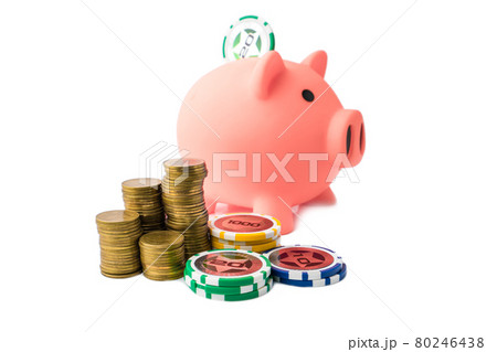 Piggy bank and money coins stack with casino chips on white background. Concept of gambling savings. Piggy bank and money coins stack with casino chips on white background. Concept of gambling savings. 80246438