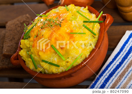 Potato casserole filled with whipped eggs 80247090