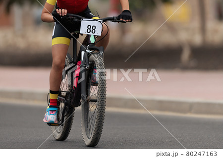 Cycling rider competing in the child class 80247163