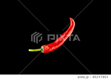 Pepper chili. Red hot chili paprika or spicy chile cayenne pepper isolated on black background. Ingredient for fresh spice mexican food. Pepper chili. Red hot chili paprika or spicy chile cayenne pepper isolated on black background. Ingredient for fresh spice mexican food. 80247803