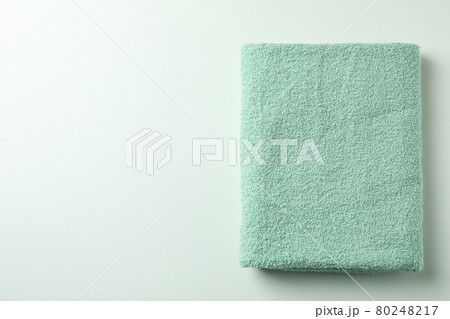 Clean green folded towel on white background 80248217