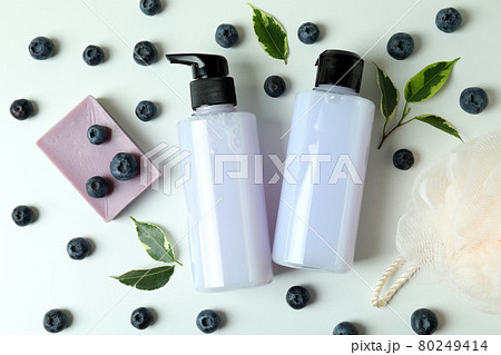 Natural bath cosmetics and blueberry on white background 80249414