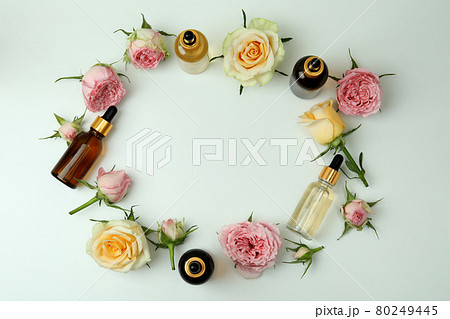 Skin care concept with essential rose oil on white background, space for text 80249445