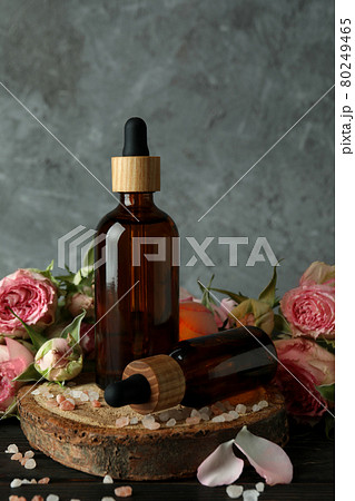 Skin care concept with essential rose oil on wooden table 80249465