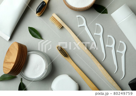 Oral care accessories on gray background, top view Oral care accessories on gray background, top view 80249759