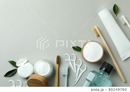 Oral care accessories on gray background, space for text Oral care accessories on gray background, space for text 80249760