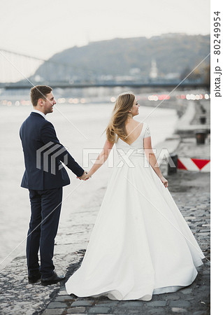 Wedding couple bride and groom holding hands 80249954