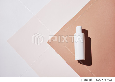 Natural cosmetic product. White bottle on pastel background Natural cosmetic product. White bottle on pastel background 80254758