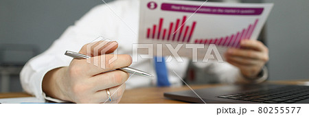 Manager holding a financial report with chart Manager holding a financial report with chart 80255577
