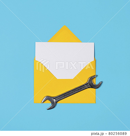 Happy father's day banner with copy space. Man or husband concept. Yellow Envelope and wrench on blue background. Happy labor day. Happy father's day banner with copy space. Man or husband concept. Yellow Envelope and wrench on blue background. Happy labor day. 80256089