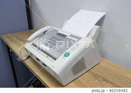 hand man are using a fax machine in the office, equipment for data transmission. hand man are using a fax machine in the office, equipment for data transmission. 80256482