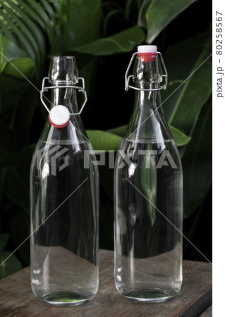 flip top clear water bottle outdoors on garden table flip top clear water bottle outdoors on garden table 80258567