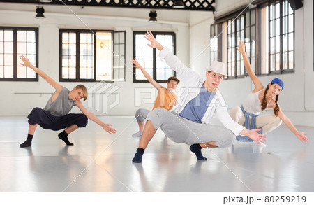 Group teenagers dancing hip-hop indoors 80259219