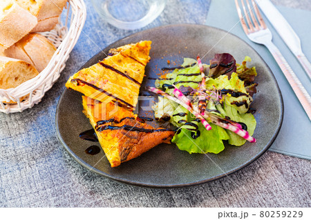 Traditional Spanish potato chorizo tortillas with lettuce closeup Traditional Spanish potato chorizo tortillas with lettuce closeup 80259229