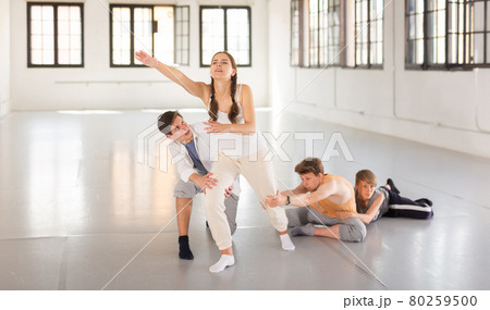 Teenagers training contemporary dance at studio Teenagers training contemporary dance at studio 80259500