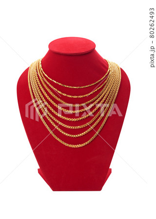 Gold necklaces on red necklace display stand. isolated on white background. Gold necklaces on red necklace display stand. isolated on white background. 80262493