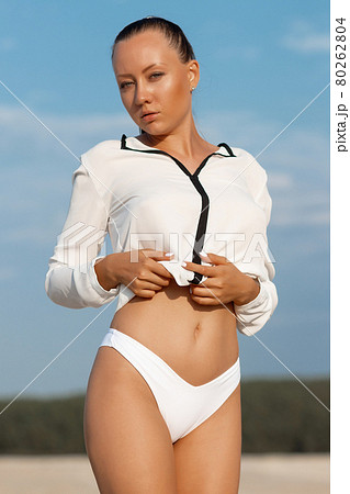 Fit hot woman taking off swimsuit panties - Stock Photo [57063154] - PIXTA