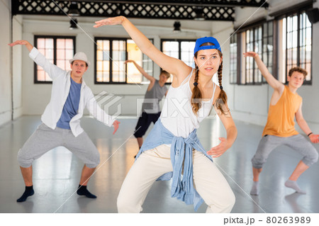 Group teenagers dancing hip-hop indoors Group teenagers dancing hip-hop indoors 80263989