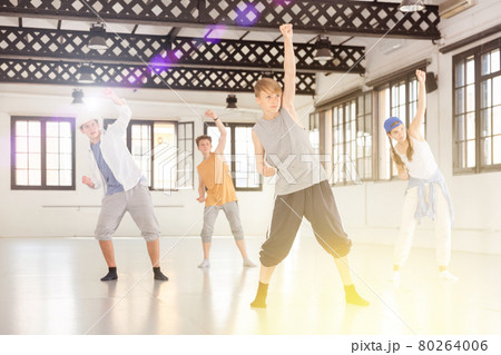 Group teenagers dancing hip-hop indoors Group teenagers dancing hip-hop indoors 80264006