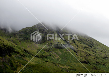 Mist Covered Mountain Top in Glencoe Scotland 80265427