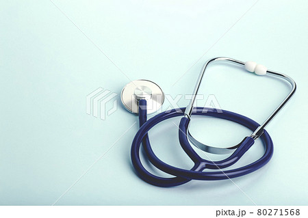 World heart day banner background. Heart as a symbol of health, treatment, charity, donation and cardiology on a blue background with a medical statoscope. 80271568