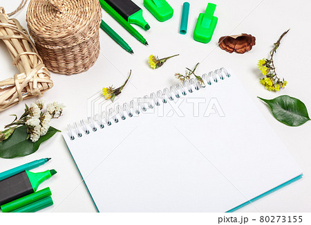 Blank page of spiral notepad on white table. Crayon pencil and pen flat lay photo. Empty sketchbook page on table top view. Blank page of spiral notepad on white table. Crayon pencil and pen flat lay photo. Empty sketchbook page on table top view. 80273155