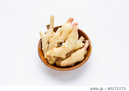 Young ginger in wooden bowl on white Young ginger in wooden bowl on white 80273273