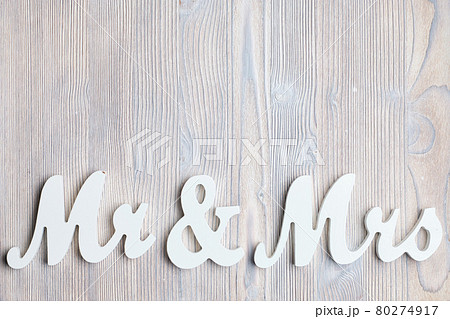 White letters mr and vhk on a wooden background. Top view. Copy space. 80274917