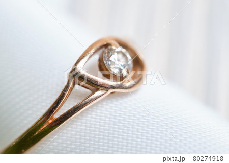 Gold wedding ring with ribbon macro. 80274918