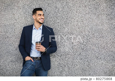 Handsome arab guy businessman with coffee to go outdoors 80275868
