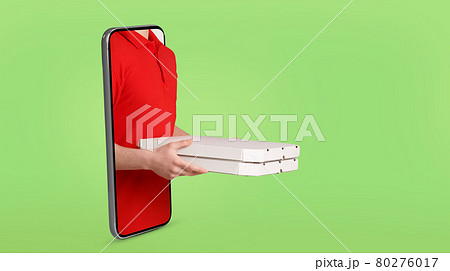 Cropped of delivery man holding pizza, standing in smartphone Cropped of delivery man holding pizza, standing in smartphone 80276017
