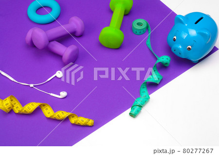 Piggy bank with sports equipment 80277267