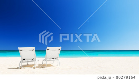 Beach chairs with umbrella and beautiful sand beach in Punta Cana, Dominican Republic. 80279164