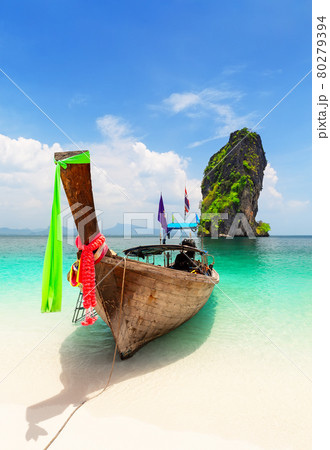 Thai traditional wooden longtail boat and beautiful sand beach at Koh Poda island in Krabi province, Thailand. Thai traditional wooden longtail boat and beautiful sand beach at Koh Poda island in Krabi province, Thailand. 80279394
